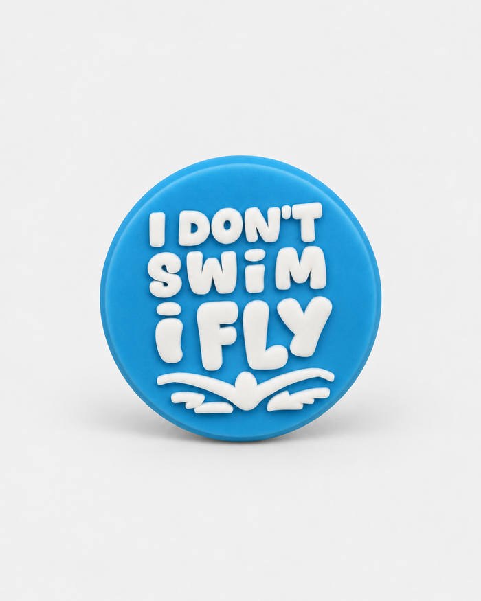 Swim Croc Charm - I don’t swim I fly Blue — studio product photograph